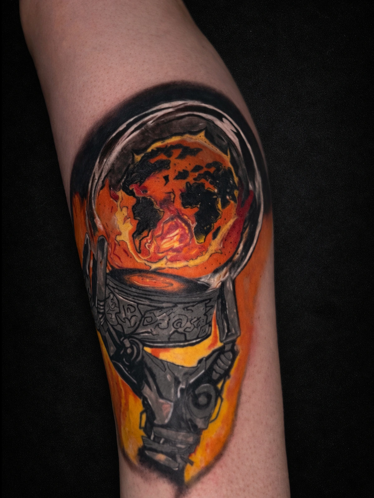 Textured forearm tattoo with a bold central composition