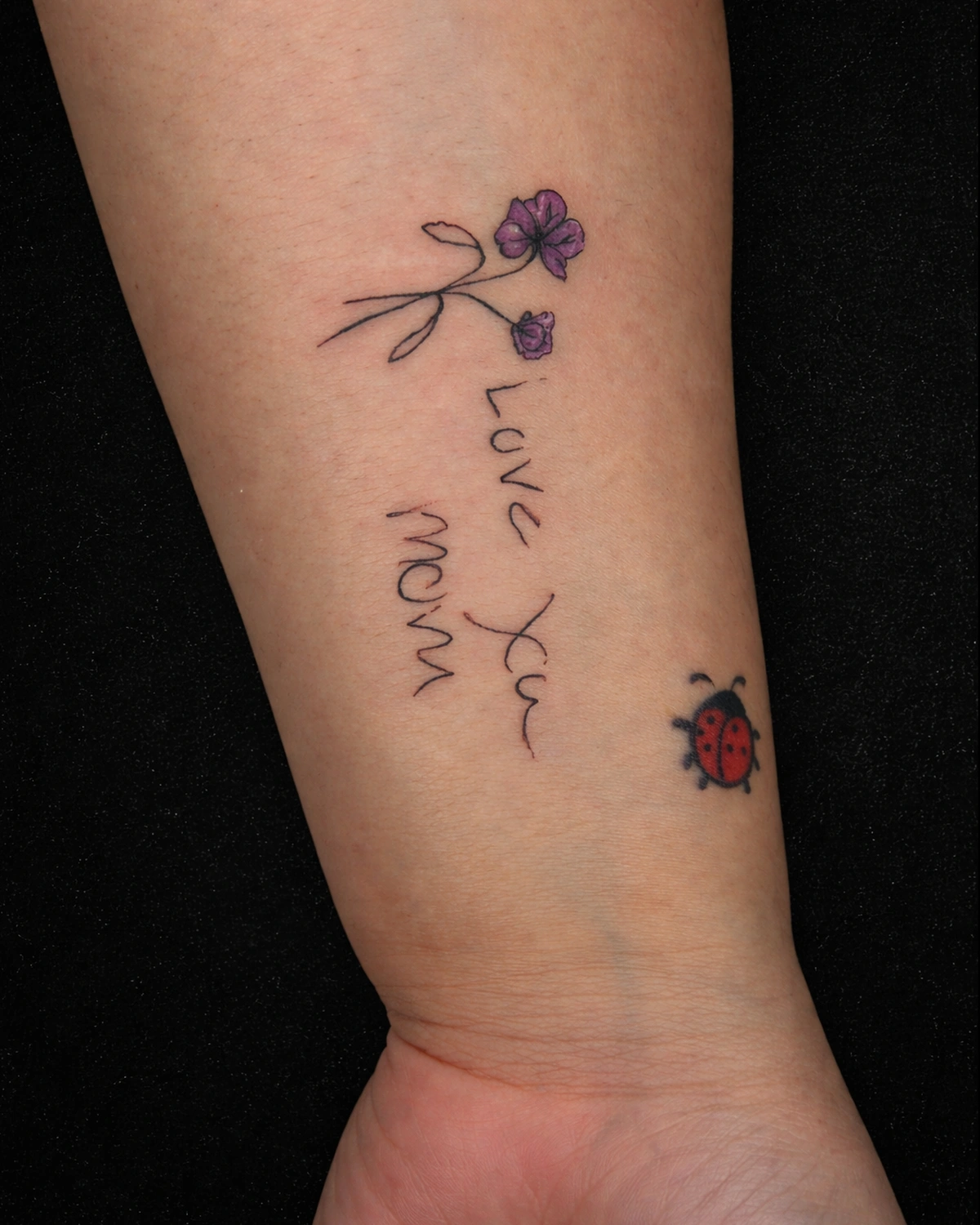 Tattoo based on a child's handwritten I love you mom note